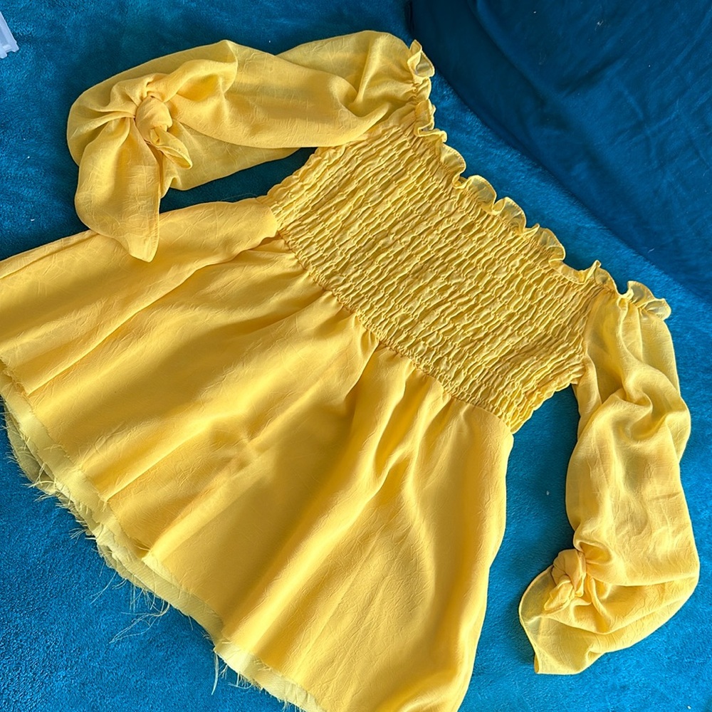 Yellow ruffle sleeves blouse.